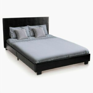 Side view of a black faux leather bed