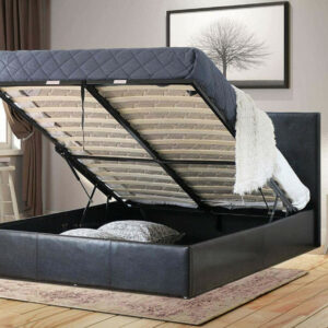 A black ottoman bed's open underbed compartment storage