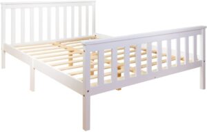 The frame of a white double bed