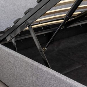 Closeup of a grey ottoman storage bed's under bed compartment construction