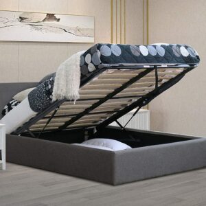Grey bailey ottoman storage bed with storage open in a light bedroom setting
