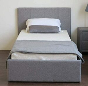 A closed grey ottoman bed in a beige bedroom